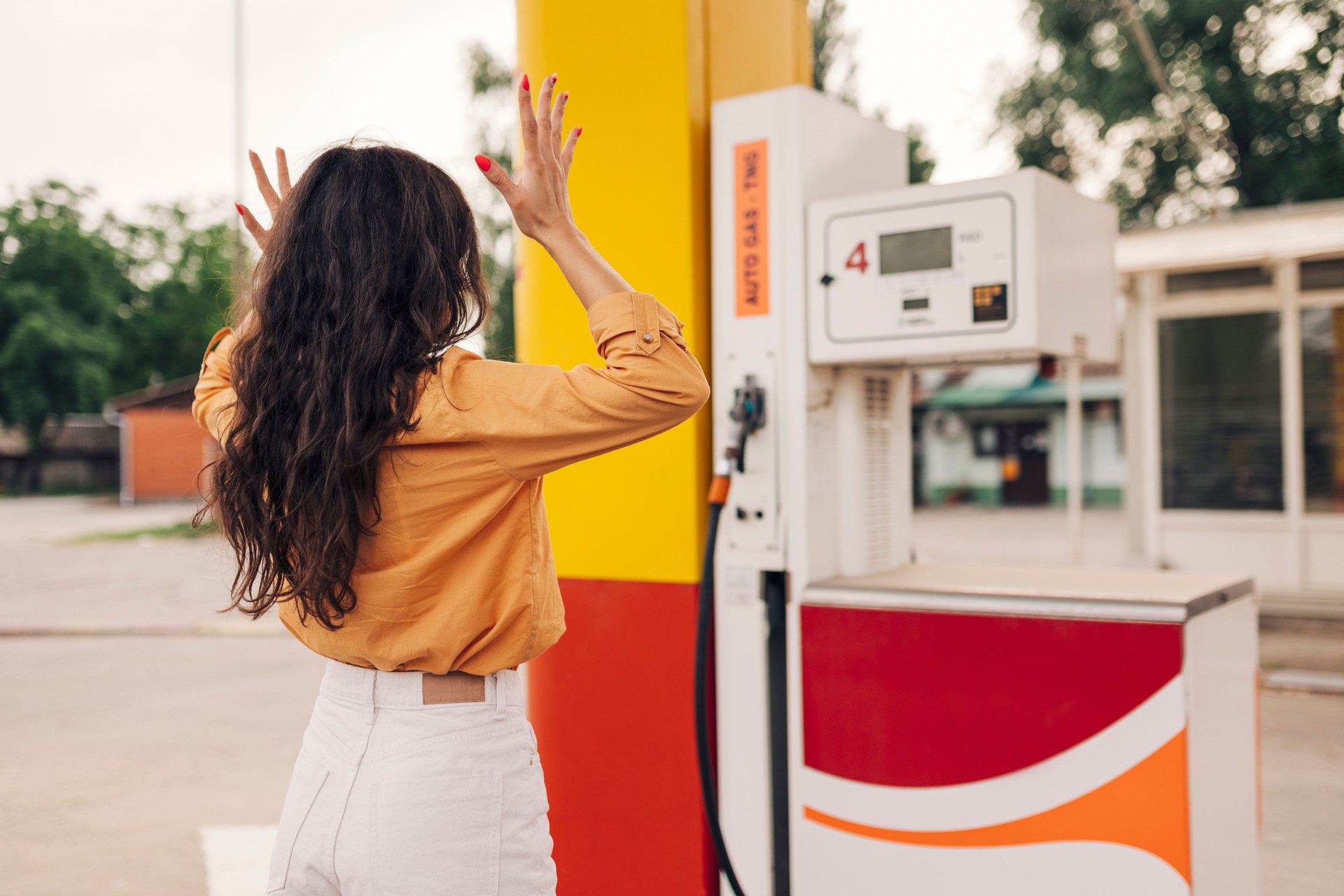 Worried woman  on gas station